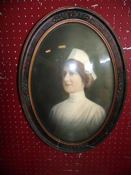 Vintage Bubble Glass Photograph of Nurse: Photograph of a nurse in a bubble glass frame. Measures 22 x 16 1/2".