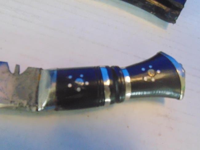 Middle Eastern Knife with Sheath: Middle Eastern knife with leather etched sheath. Lion head in relief on the end of the grip and has a metal tip on sheath.