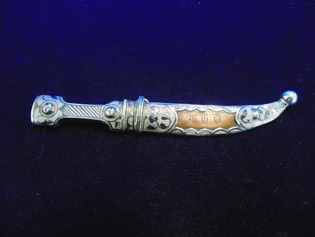 Silver Knife in Sheath: Ornate silver knife with monogram. 5" long.