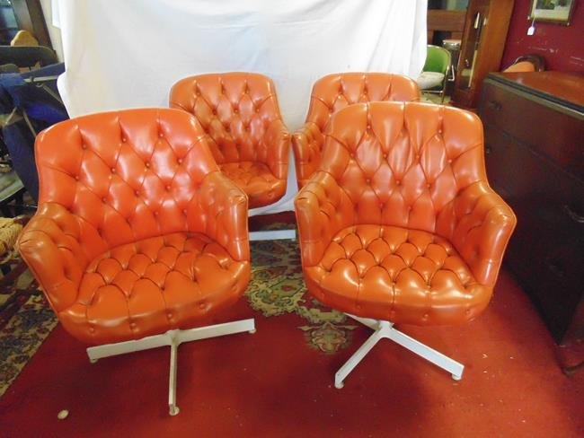 Jack Cartwright Tufted Vinyl Chairs: Set of 4 Signed Jack Cartwright vinyl swivel chairs with tufted backs and seats and white iron X bases. 2 buttons missing on one chair and one button missing on another. They are still tight.