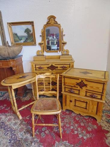 Cottage Pine Decorated Bedroom Set: Cottage pine bedroom set consisting of a dresser and mirror, oval stand wit one drawer, lift top washstand and a cane seat chair. Cane is damaged in chair. Overall very good condition.