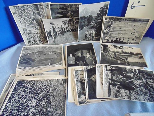 German Photo Series of 1936 Olympics & Hitler: Set of over 75 separate picture photos of the Olympics with Jessie Owens many featuring Adolph Hitler and Nazi members. Each piece has description on back. All in German.