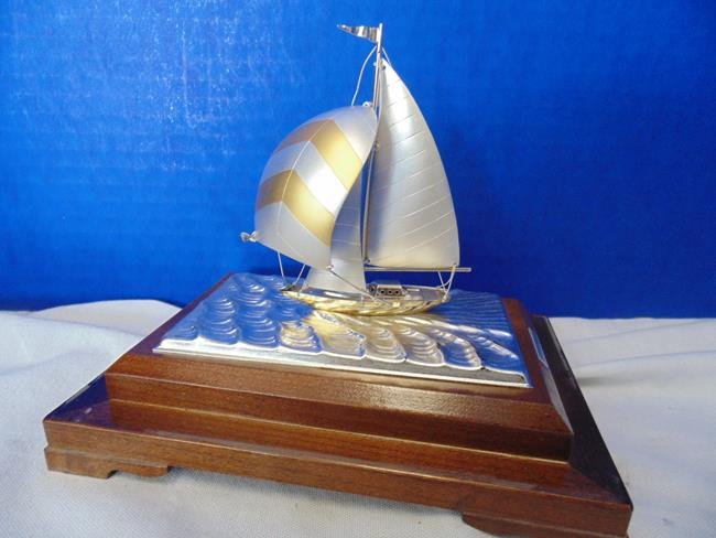 Sterling Silver Ship Model by Seki Takehiko: Sterling silver ship model signed by Seki Takehiko. Case measures 6 1/2" by 6 1/4".