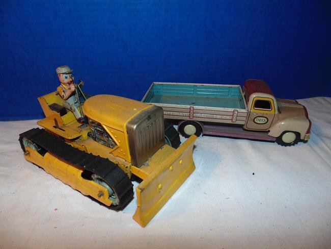2 Tin Litho Trucks: Bulldozer with man battery op 7" and an International Tin litho truck. 9"