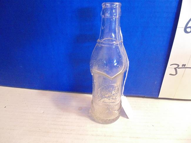 Coca Cola Indian Chief Bottle: Lowell Mass Property of Coca Cola 8 " bottle wiht embossed Indian Chief Head.