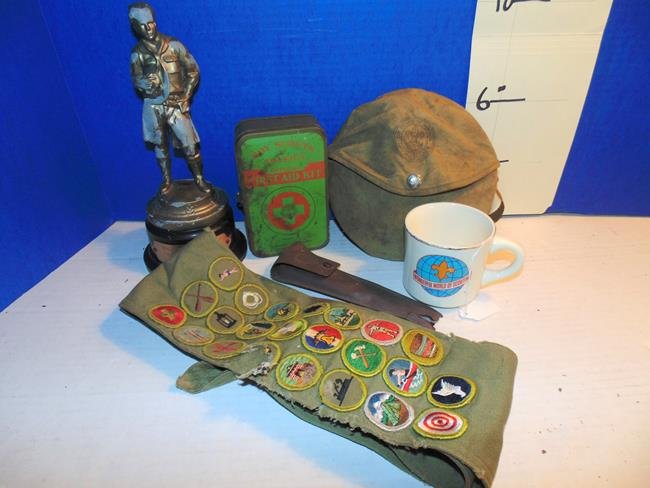 Boy Scout Items: Boy Scout sash with badges, Mug, Canteen, First Aid Kit, Spoon, Fork & Knife Set and Statue,