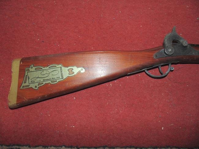 Toy Long Arm Cap Gun: Wood cap gun 51" long.