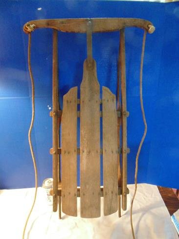 Wood Child's Sled: 29" long wood sled with metal runners.