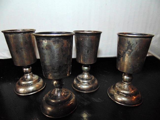 Sterling Silver Shot Glasses: Sterling silver footed shot glasses. Weight 1.60 ounce