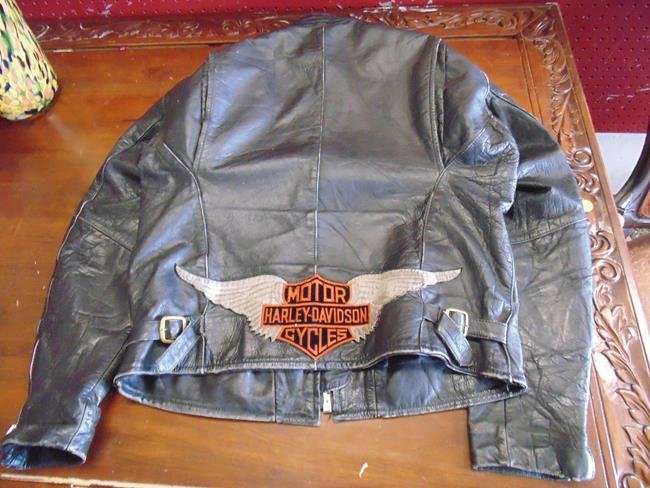 Leather Motorcycle Jacket with Harley Davidson: Leather motorcycle jacket with large Harley Davidson emblem on back.