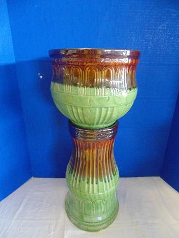 Jardinaire and Pedestal: 22" tall green and brown matching jardinaire and pedestal. Chip on rim of jardinaire.