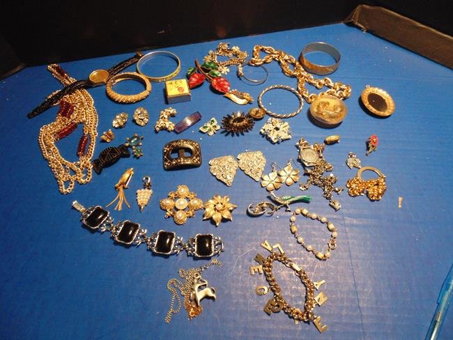 Costume Jewelry: Assorted costume jewelry including necklaces, sweater clip, brooches, earrings, rings and bracelets.