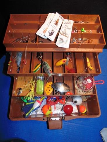 Fishing Tackle: Fishing box full of lures and other items.