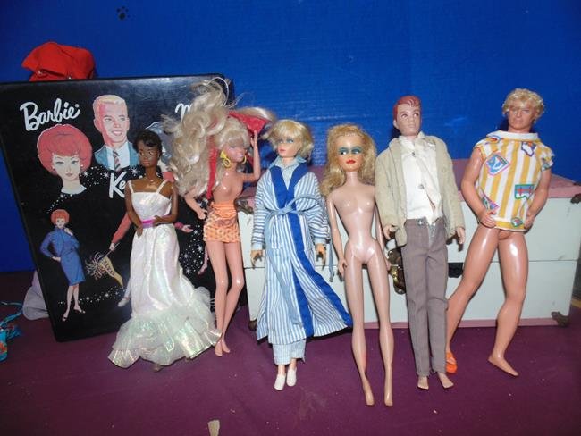 Barbie Dolls: Barbie Dolls, suitcases and clothes.