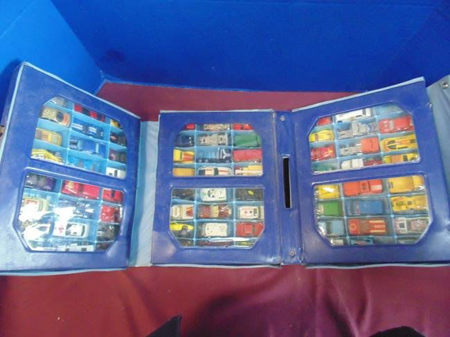Miniature Matchbox Cars: Matchbox cars in tri fold case with Hot Wheels cars. 72 cars in case.