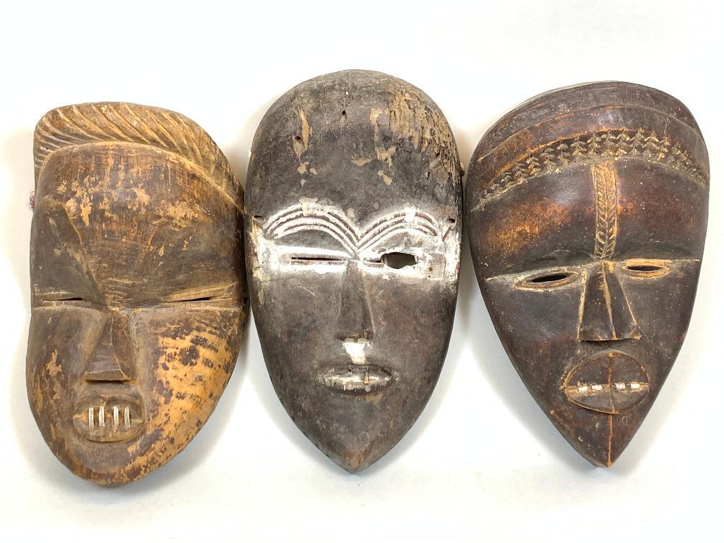 Tribal Wooden Masks: Three tribal wooden masks from Liberia, one mask marked Gio