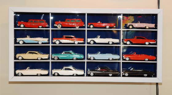 16 Ford model cars displayed in a white box, 18.5": 16 Ford model cars displayed in a white box, 18.5" X 38.5"