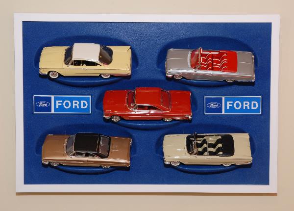 5 Ford cars in a promotional wall display: 5 Ford cars in a promotional wall display