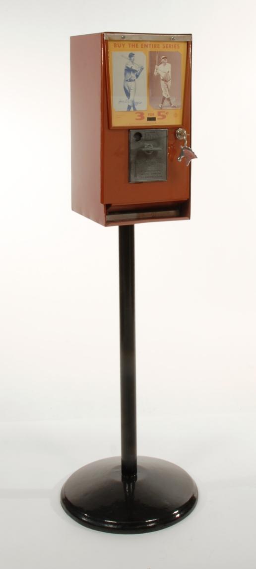 Brown baseball card vending machine on stand: Brown baseball card vending machine on stand