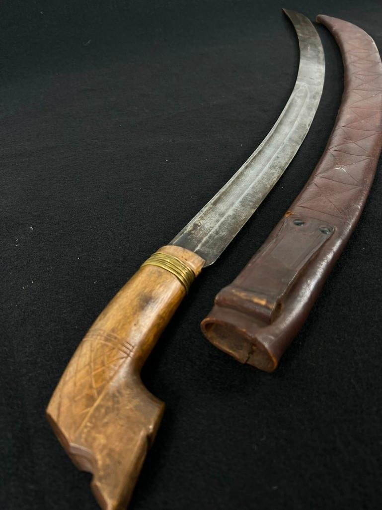 Horn of Africa Sword: Horn of Africa sword carved wood hilt leather scabbard curved blade, 34"