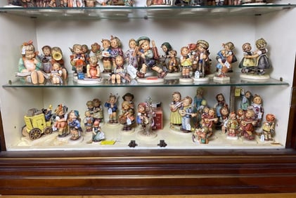 Hummel Figurine Two-Shelf Lot