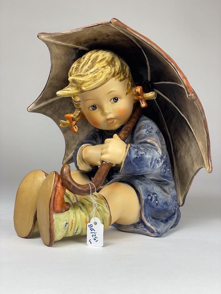 Hummel Figurine: Umbrella Girl (7") 152 II B TMK5 or 6 dated 1972 Low Estimate: 50, High Estimate: 1000 This lot is from the Jack and Bette Lessard extensive Hummel Collection. Descriptions, titles, mold numbers, TMK