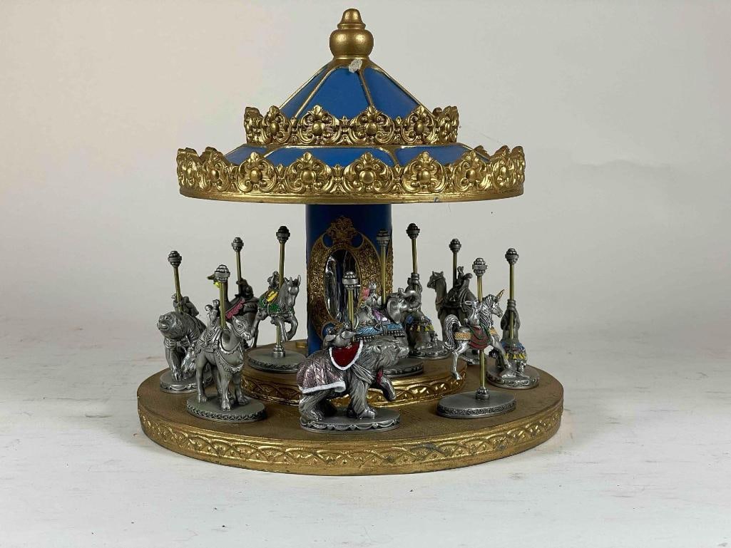 Pewter Carousel And Display Lot: Pewter Carousel and display lot Low Estimate: 50, High Estimate: 1000 This lot is from the Jack and Bette Lessard extensive pewter figurine collection. Descriptions, titles, and basic information have