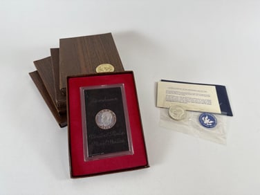 One Eisenhower Silver Dollar and Five Uncirculated Eisenhower Dollars