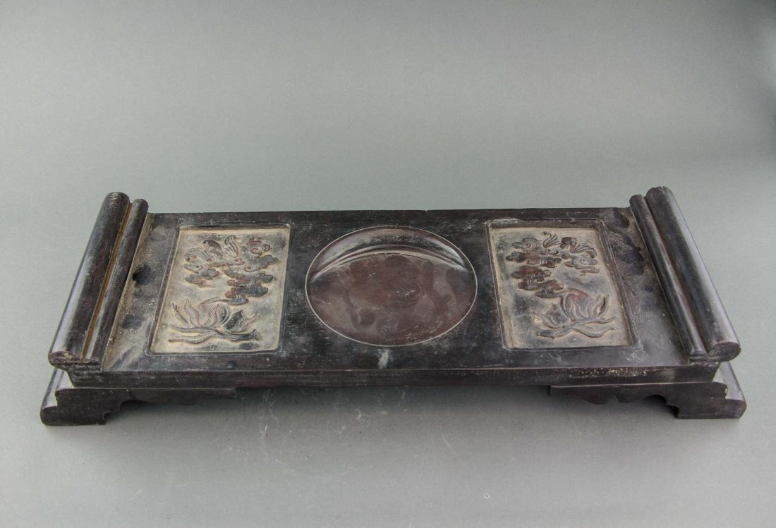 Chinese Large Table Ink Stone with Guangxu Mark: Chinese large ink stone; of table form; carved with lotus flower and bats; inscribed with Chinese calligraphy on back and signed by artist; Guangxu 7 Year mark on back; 50 cm x 19 cm, 8kg
