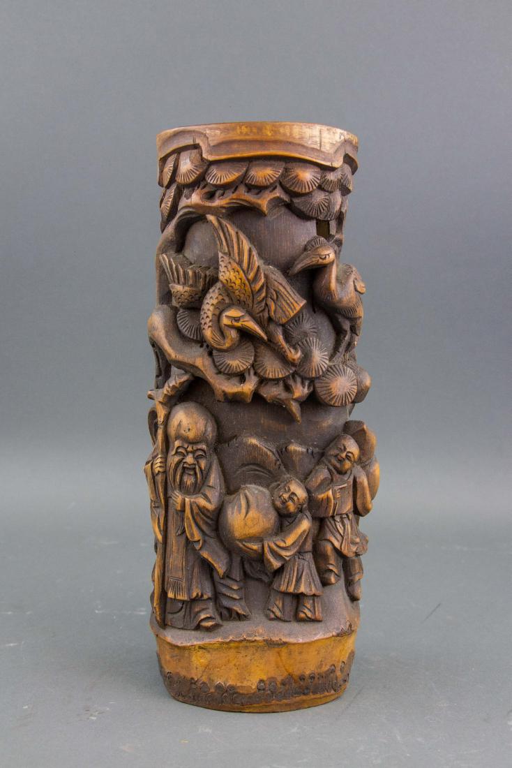 Chinese Bamboo Carved Vase: Chinese bamboo carved vase; of natural bamboo trunk from; carved with high relief the Old Man of South Pole, children and cranes; H: 34 cm, D: 16 cm, 1010 grams