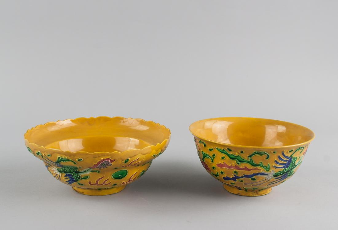Two Chinese Yellow Ground Porcelain Bowl Hongzhi: 2 pieces of Chinese yellow ground porcelain bowl; one of foliated edge, one of flat edge; tapering to bottom; supported on short foot rim; carved with dragon, phoenix and flower; painted with red, blu