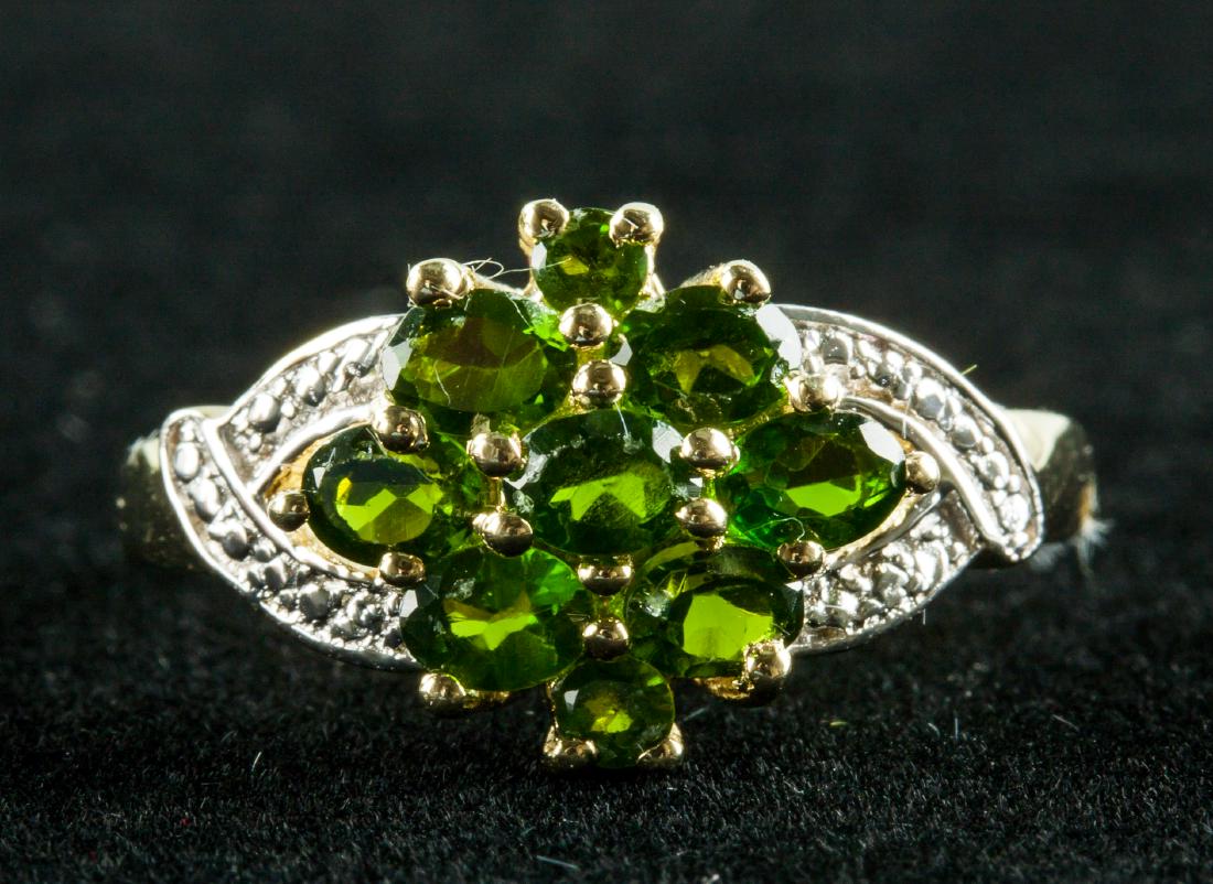 1.80ct Diopside Ring CRV $880: Stamped 925 silver and gold plated yellow gold ring. Set with 1.80ct oval cut, slightly included, green colored diopside. Certified replacement value $880. 3.50 grams.