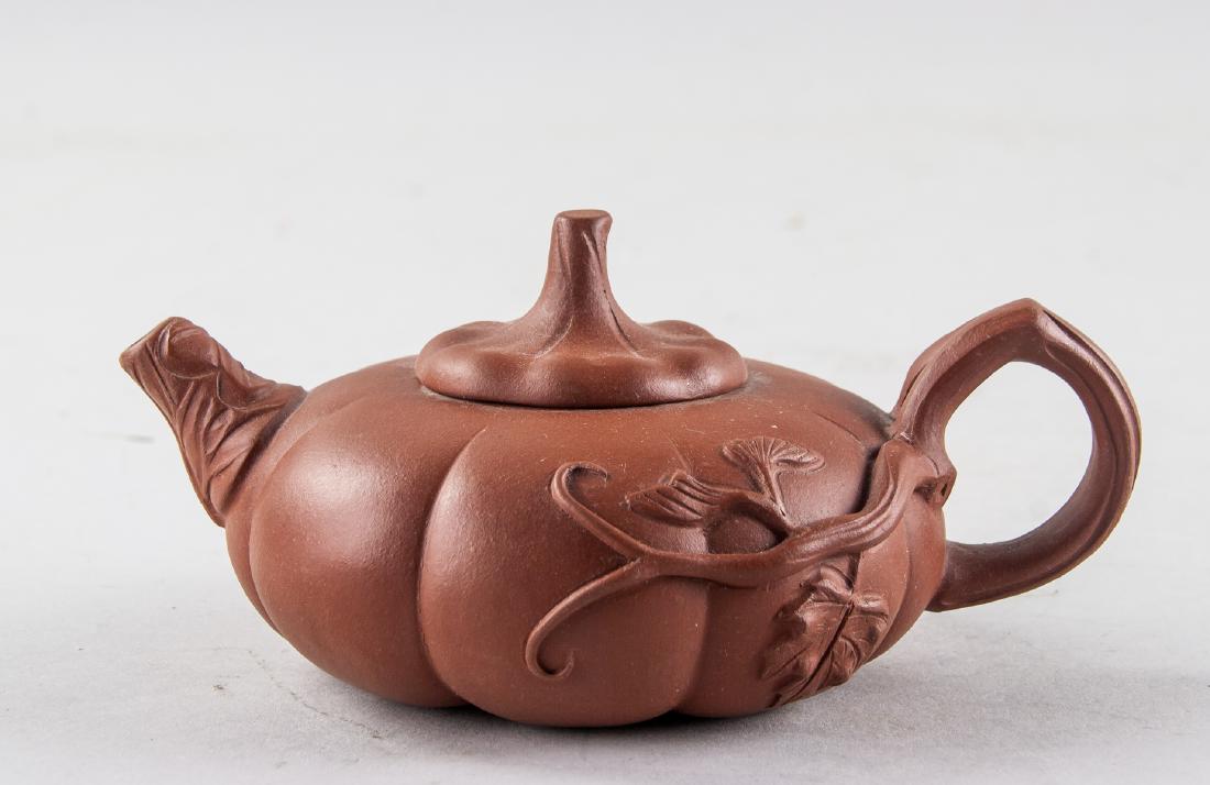 Chinese Zisha Pumpkin Teapot JIANG RONG Mark: Chinese Zisha pottery teapot, featuring a pumpkin form body, flanked with vine form spout and handle, with artist Jiang Rong mark on base, 8 x 14 cm, 148 grams