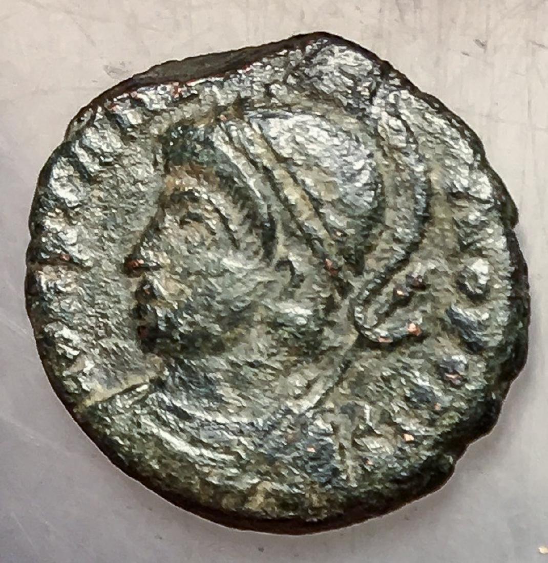 330-346 Roman Empire Constantinopolis Bronze Coin: 330-346 Roman Empire Constantinopolis Comemmorative bronze coin, obverse engraved helmeted bust of Constantinopolis left, reverse engraved Victory standing on prow of ship holding scepter and shield, 