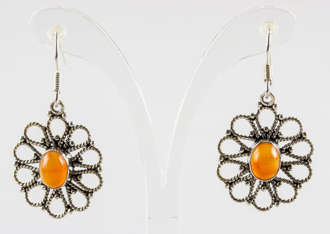 Carnelian Flower Earrings: Stamped 925 silver flower pattern earrings. Set with oval cut, orange colored carnelian. 2.3 grams (each)