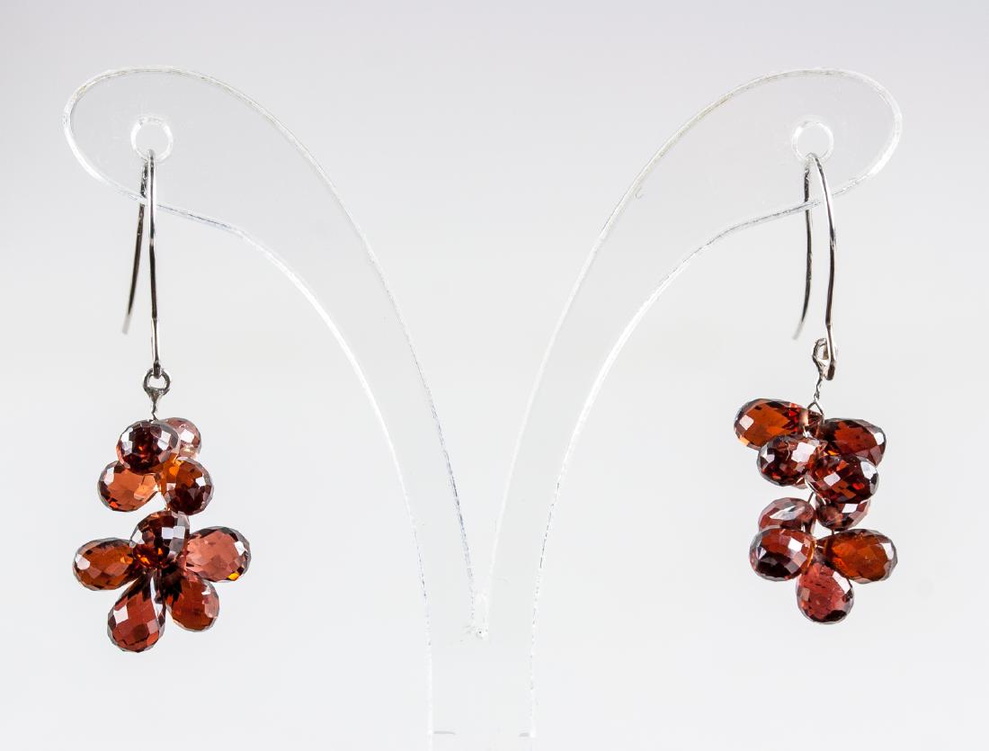 14.1ct Garnet Drop Earrings CRV $767: Stamped 14k white gold earrings. Set with 14.10ct briolette cut, slightly included, brownish red colored garnet. Certified replacement value $767. 2.72 grams