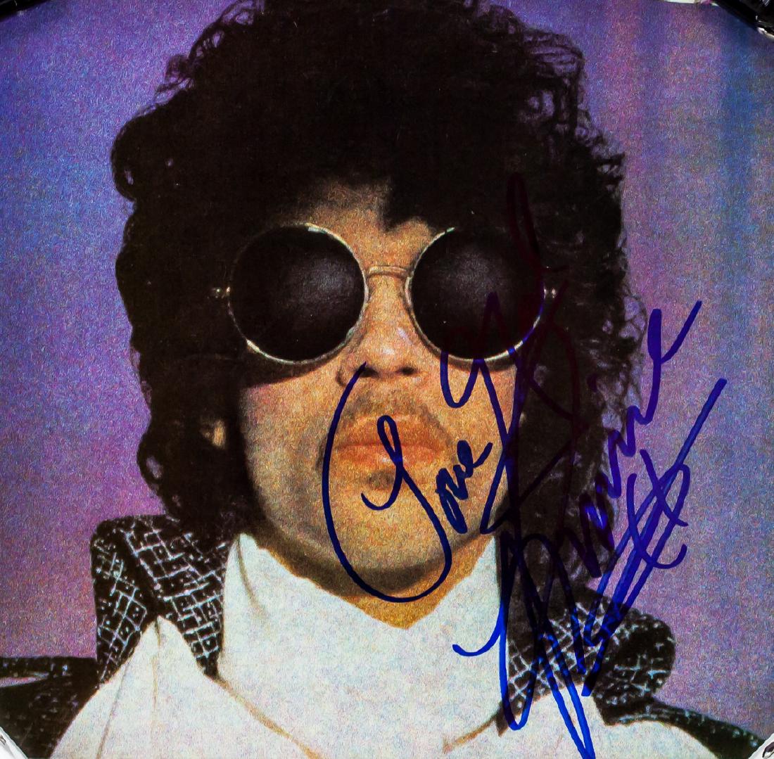 Prince Autographed Photograph JSA Letter: An autographed photograph signed and featuring American musician Prince (1958-2016, American). With letter of authenticity offered by James Spence Authentication. 17.7 x 18.4 cm (6.9 x 7.2 inches). PR