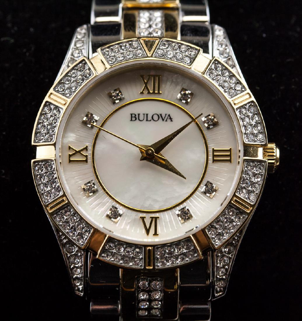 Bulova Ladies' Crystal Two-Toned Watch: Bulova ladies' watch. Stainless steel. Water resistant. Small scratches on back.