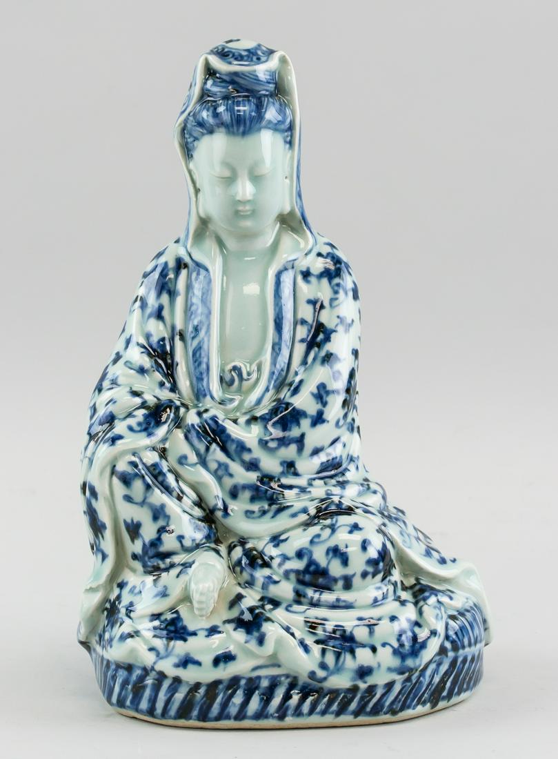 Chinese Republic White & Blue Porcelain Guanyin: Chinese Republic blue and white porcelain statue. Featuring seated Guanyin Bodhisattva on lotus pedal base. Six-character Ming dynasty Xuande mark on back. 26 x 17 cm, 1704 grams