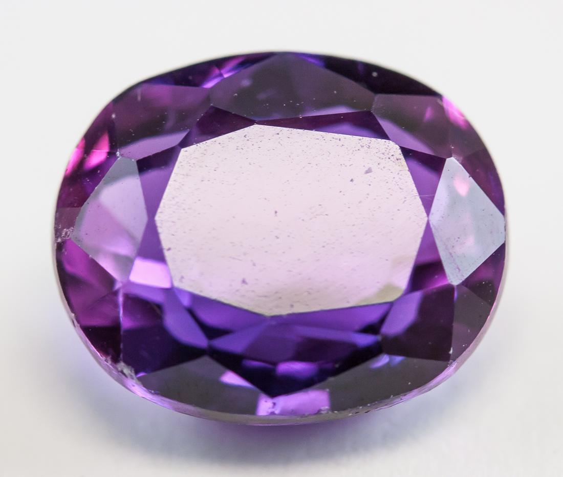 8.90ct Oval Cut Purple Natural Alexandrite GGL: One (1) 8.90 ct oval cut purple natural alexandrite gemstone. 12.20 x 10.18 x 6.59 mm. Accompanied with GGL certificate.
