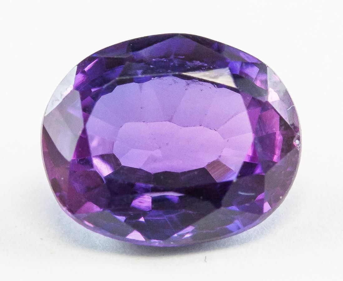 8.55ct Oval Cut Purple Natural Alexandrite GGL: One (1) 8.55 ct oval cut purple to blue alexandrite gemstone. 12.49 x 10.98 x 4.39 mm. Accompanied with GGL certificate.