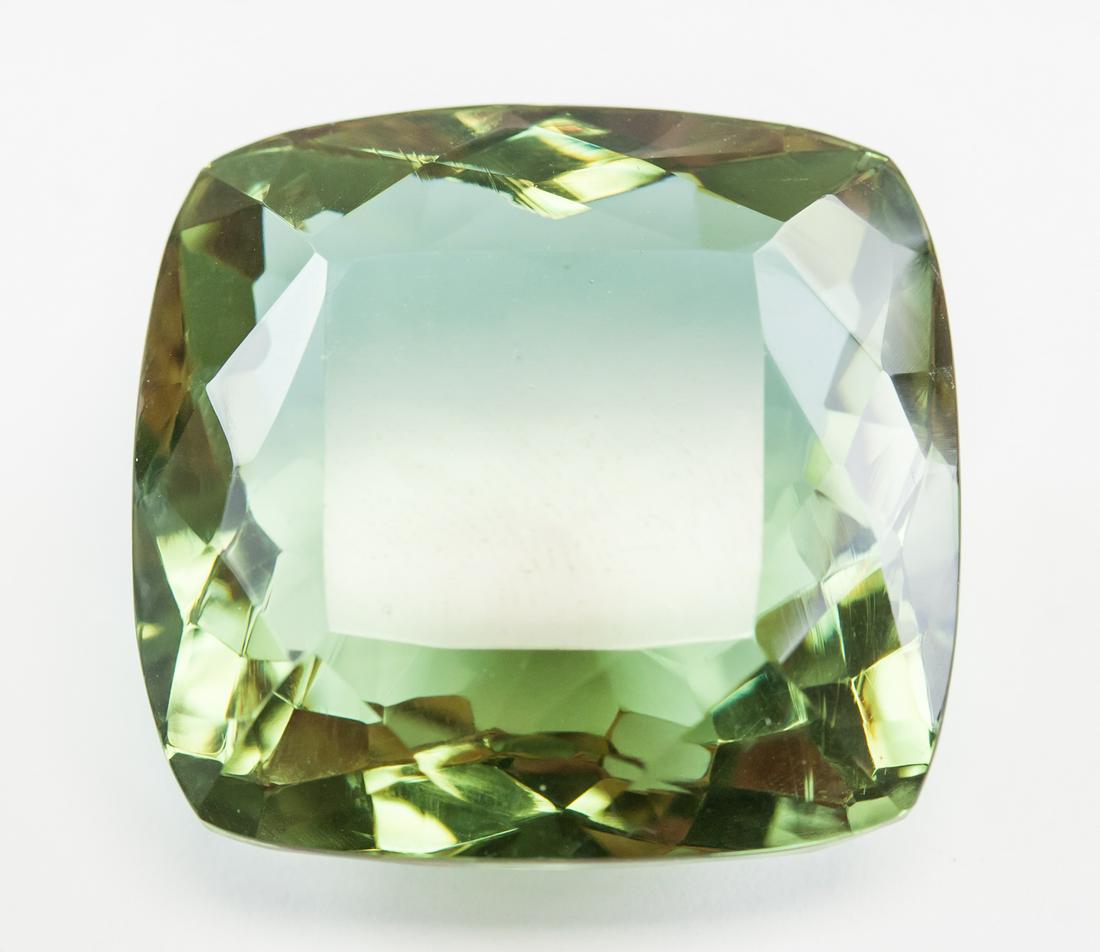 73.90ct Cushion Cut Brown to Green Alexandrite GGL: One (1) 73.90 ct cushion cut brown to green alexandrite. Origin: Brazil. Accompanied with GGL certificate. 26.34 x 25.25 x 15.35 mm