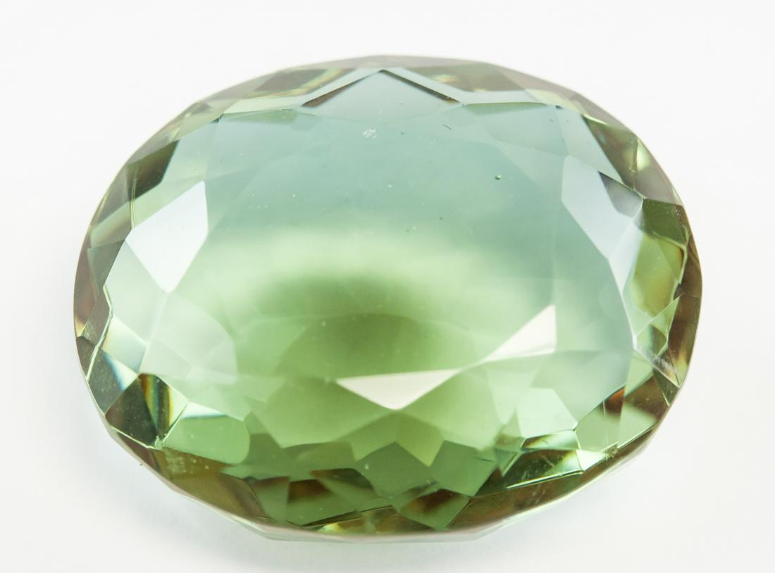 74.75ct Round Cut Brown to Green Alexandrite GGL: One (1) 74.75 ct round cut brown to green alexandrite. Origin: Brazil. Accompanied with GGL certificate.