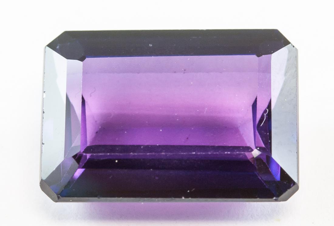 14.60ct Emerald Cut Blue Natural Alexandrite GGL: One (1) 14.60 ct emerald cut blue to purple natural alexandrite. Origin: India. 16.01 x 11.72 x 6.02 mm. Accompanied with GGL certificate.