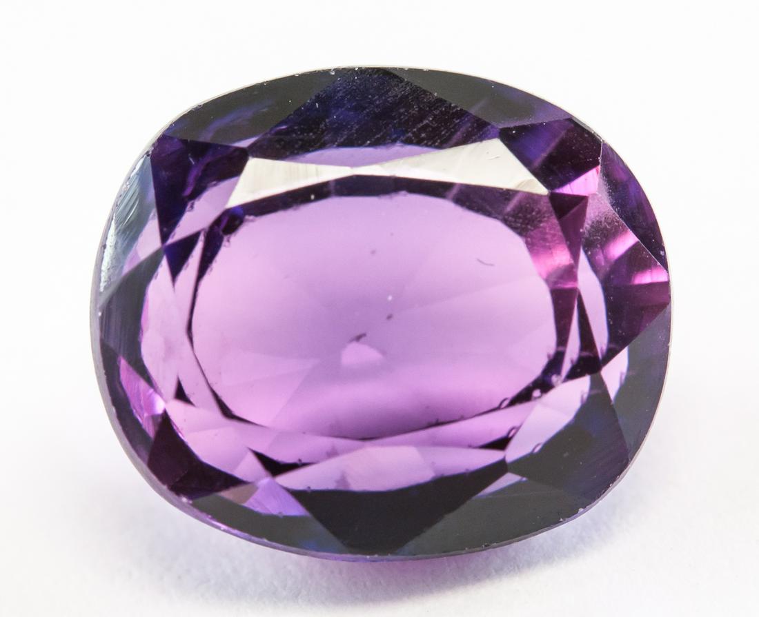 6.90ct Oval Cut Purple Natural Musgravite GGL: One (1) 6.90 ct oval cut purple-pink natural musgravite. Origin: Burma (Mogok). Accompanied with GGL certificate. 11.21 x 9.56 x 5.78 mm.