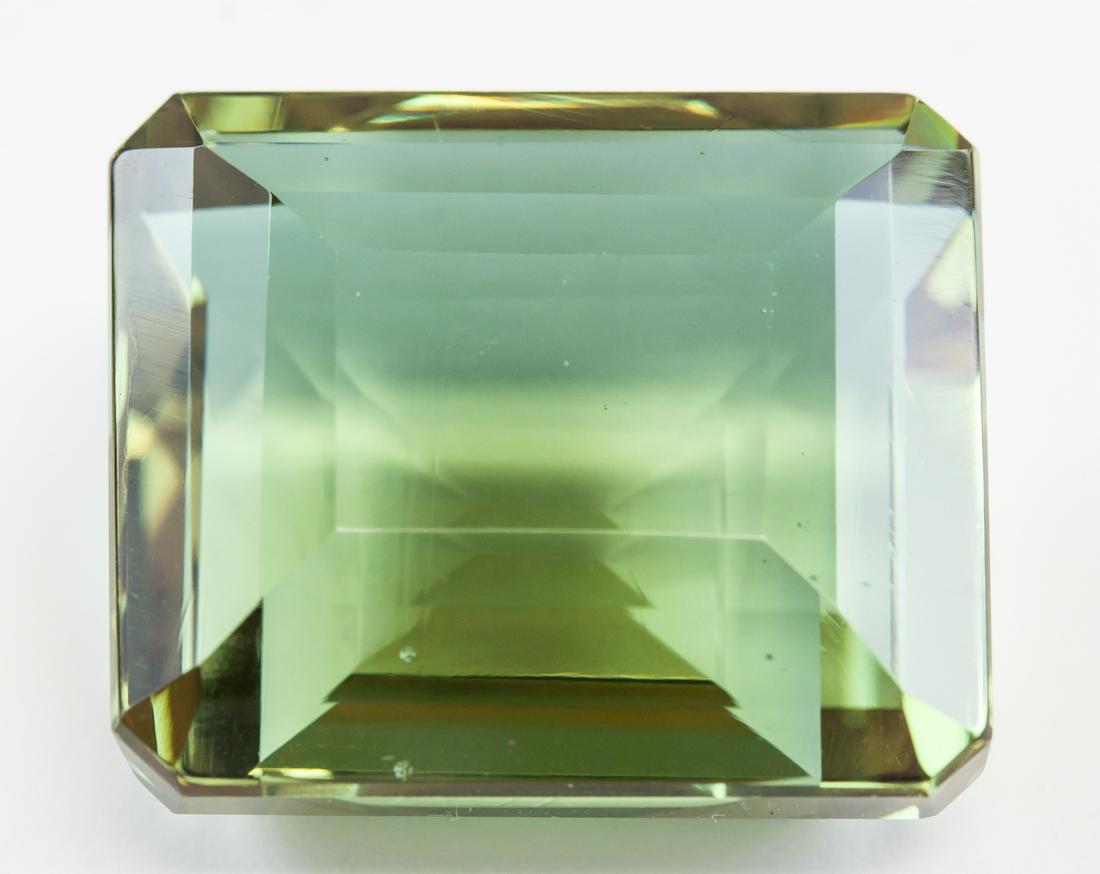 98.30ct Emerald Cut Brown to Green Alexandrite GGL: One (1) 98.30 emerald cut brown to green Alexandrite. Origin: Brazil. Accompanied with a GGL certificate. 28.11 x 23.79 x 16.15 mm