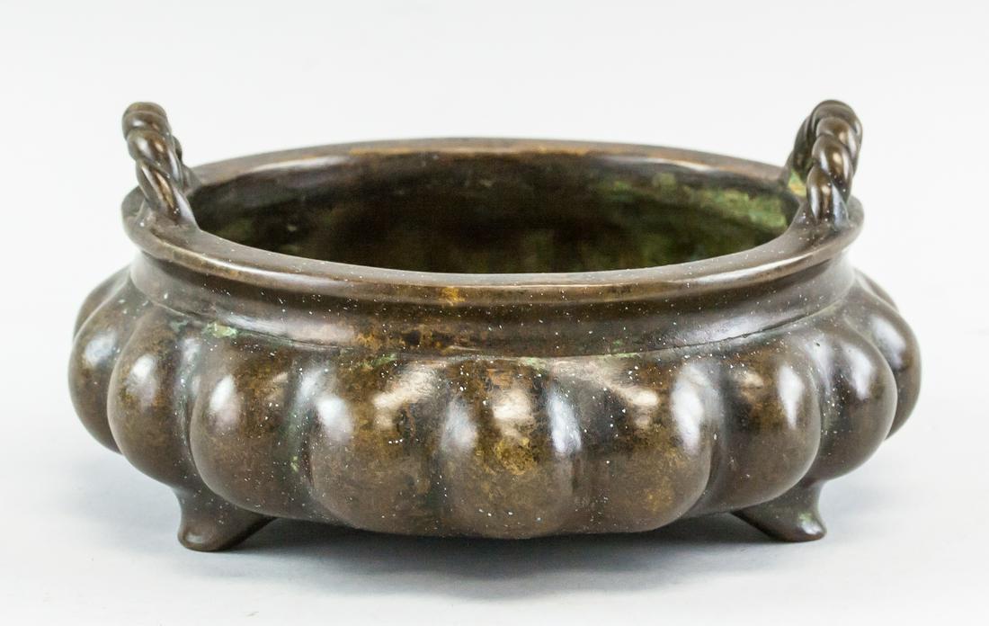 Chinese Bronze Lobed Censer Xuande Mark: Chinese bronze censer. Of flat lobed form. With two handles rising from the lip. Six character Ming dynasty Xuande mark on base. 7 x 17 cm, 1881 grams.