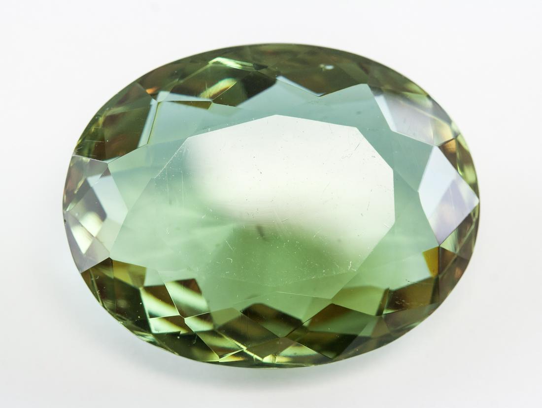 68.25ct Oval Cut Green Natural Alexandrite GGL: One (1) 68.25 ct oval cut brown to green natural alexandrite. Origin: Brazil. Accompanied with GGL certificate. 31.07 x 24.31 x 13.02 mm.