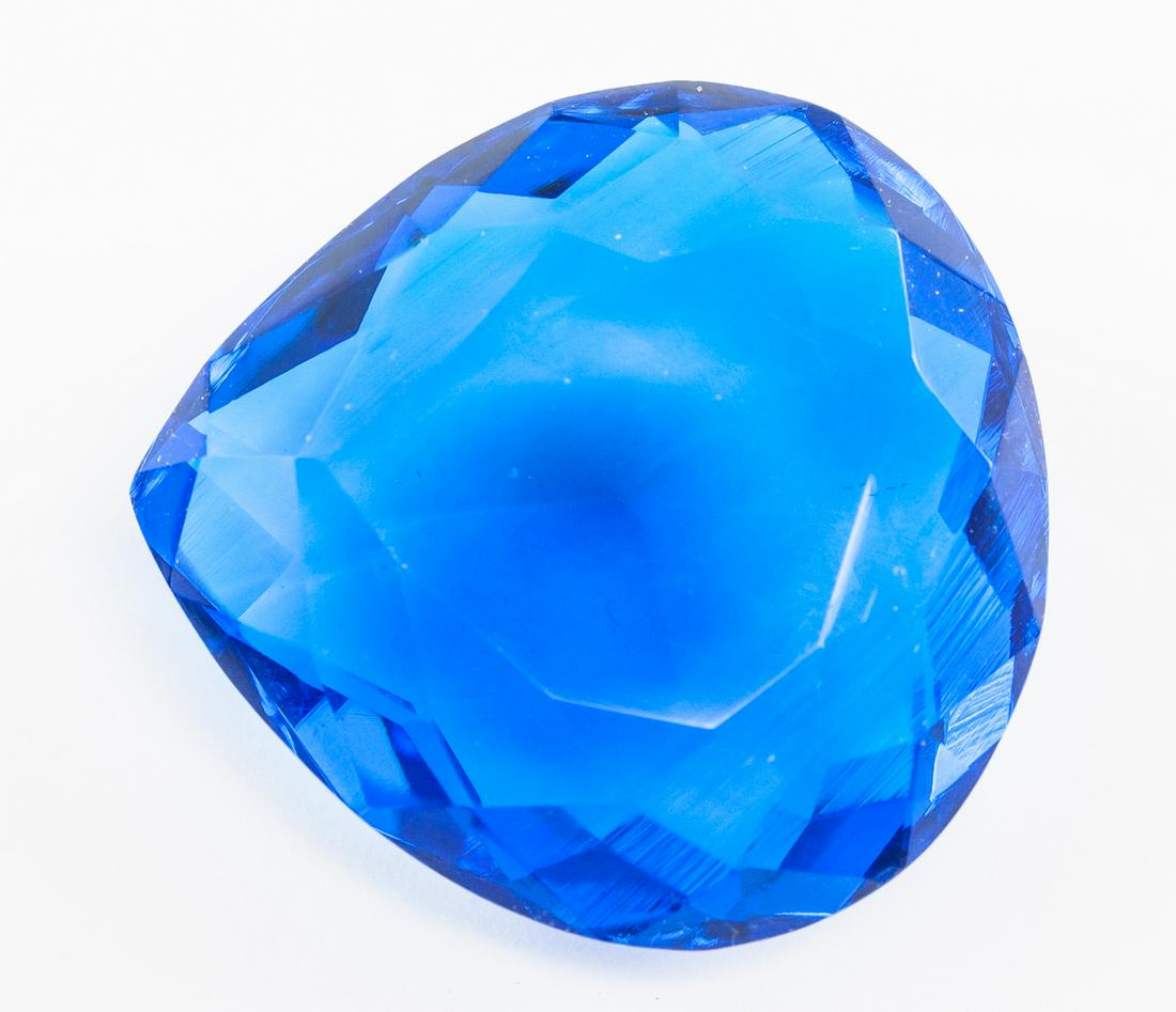 90.20ct Pear Cut Blue Tanzanite GGL: One (1) 90.20 ct pear cut blue tanzanite. Origin: Tanzania. Accompanied with GGL certificate. 33.65 x 32.28 x 13.92 mm.