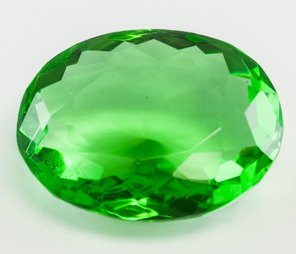 76.55ct Oval Cut Green Peridot GGL Certificate: One (1) 76.55 ct oval cut green "PERIDOT". Origin: Brazil. Accompanied with GGL certificate. 32.40 x 25.40 x 14.47 mm